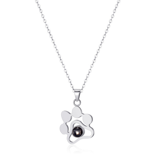 Silver-tone paw print projection pendant necklace