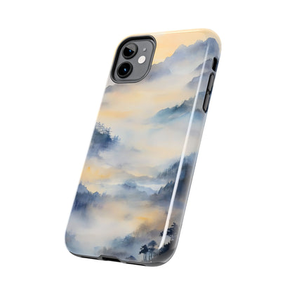 iPhone case with misty mountain landscape watercolor design in blue and gold tones