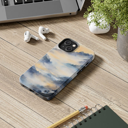 Phone case with tranquil watercolor landscape art on desk with laptop, earphones, and plant