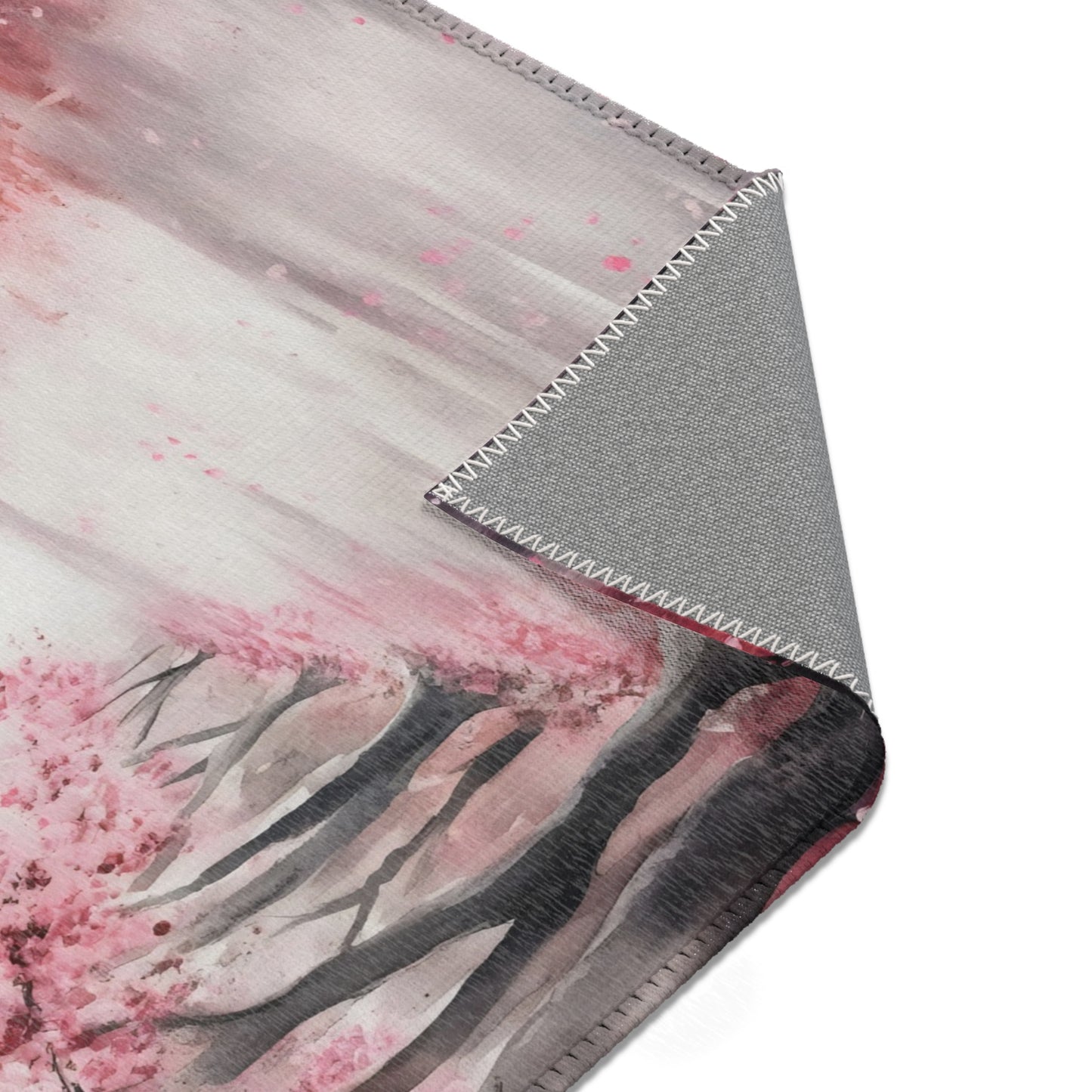 Soft blanket with watercolor pink cherry blossom trees and grey stitched edge