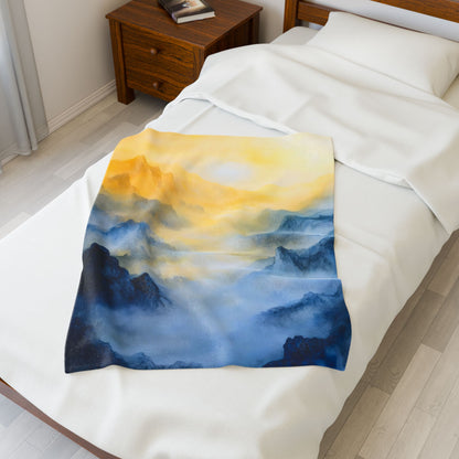 Cozy bed with a blanket featuring a misty mountain sunrise art design, bedroom decor