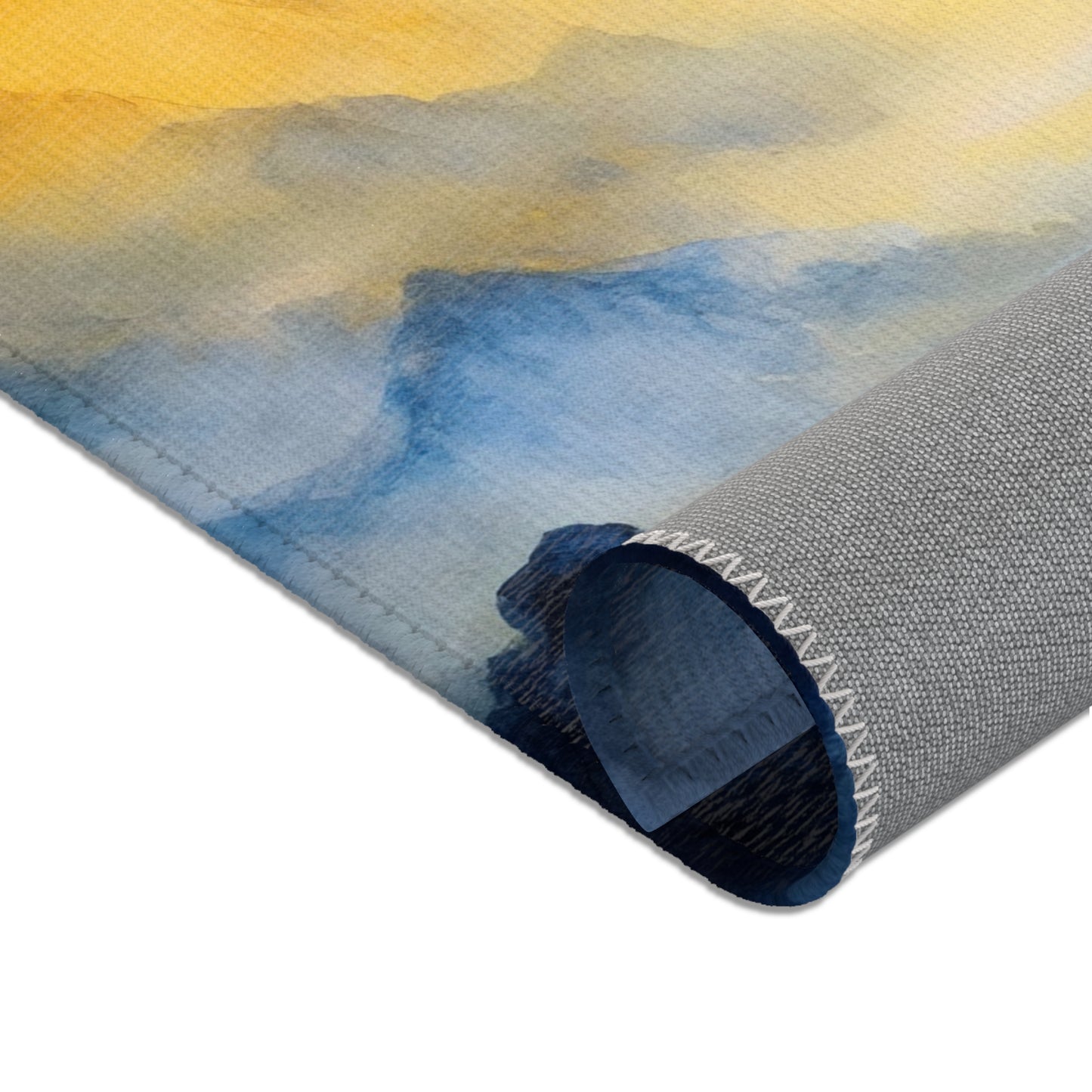 Rolled canvas wall art with abstract blue and yellow watercolor design, close-up view