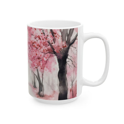 White ceramic mug featuring a pink cherry blossom tree watercolor design