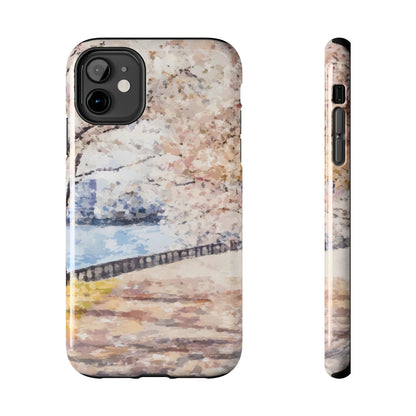iPhone case with watercolor cherry blossom tree and serene riverside landscape design