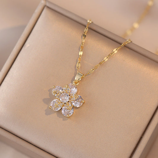 Clear crystal flower necklace on a pale jewelry tray