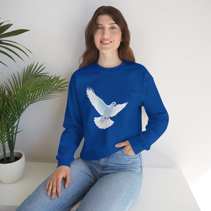 Woman wearing blue sweatshirt with white dove graphic, faith-inspired Christian apparel