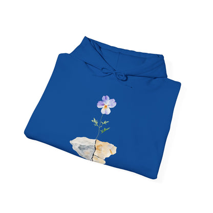 Blue hoodie with watercolor flower growing from cracked stone graphic
