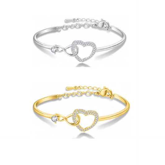 Silver-tone and gold-tone heart charm bracelets displayed together