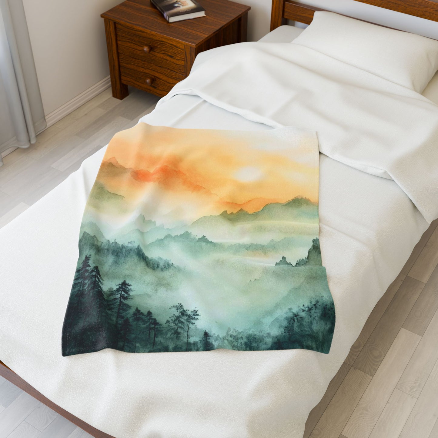 Cozy bed with soft blanket featuring watercolor mountain sunrise landscape, bedside table