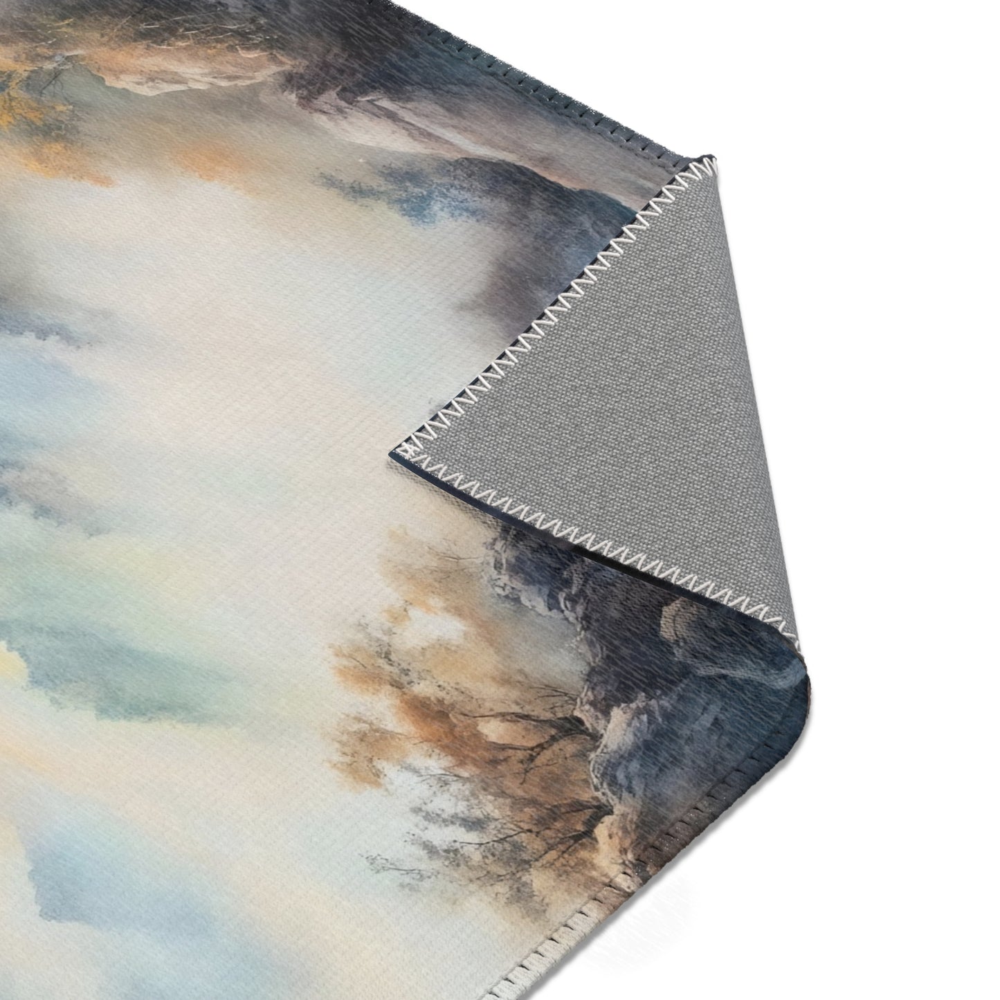Serene landscape watercolor print on a fabric wall hanging with stitched edges