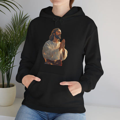 Woman wearing black Christian hoodie with praying Jesus graphic, faith apparel indoors
