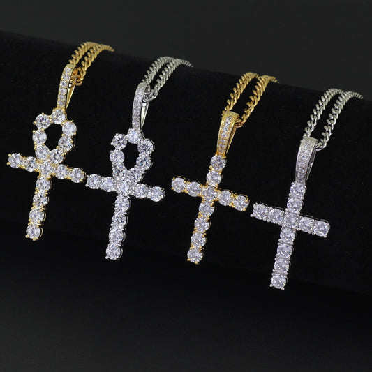Gold-tone and silver-tone crystal cross necklace designs displayed together