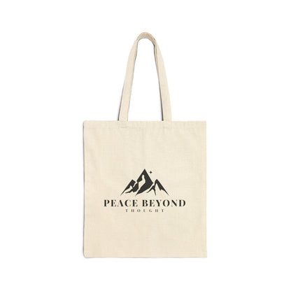 Natural canvas tote bag with mountain graphic and 'Peace Beyond Thought' text on front