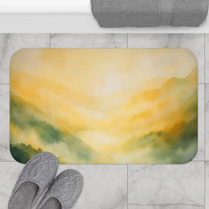 Yellow and green mountain landscape bath mat on marble floor with cozy gray slippers