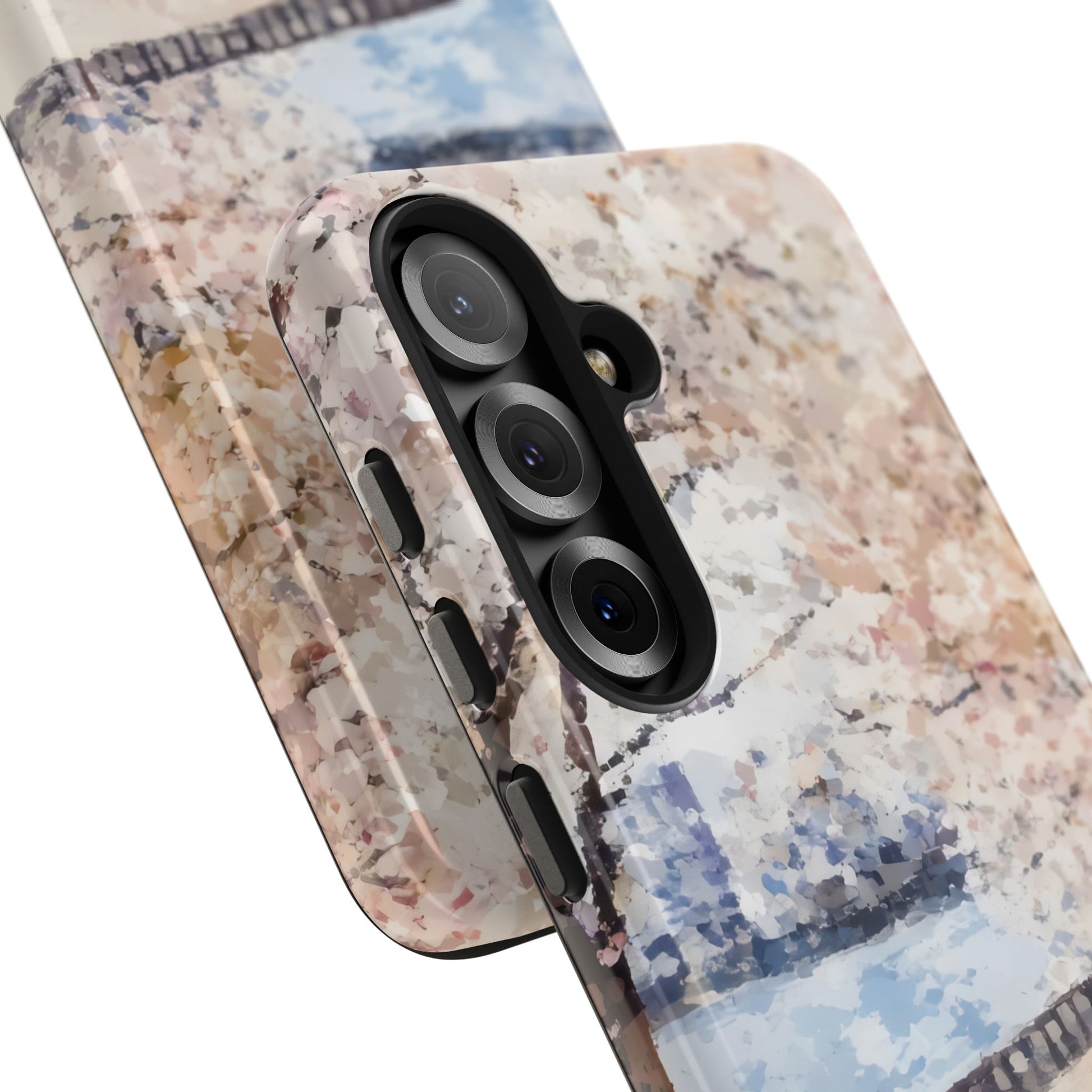 Close-up of two phone cases with abstract pastel floral pattern and bridge design