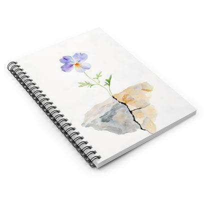 Spiral notebook with watercolor violet flower growing through cracked stone cover design