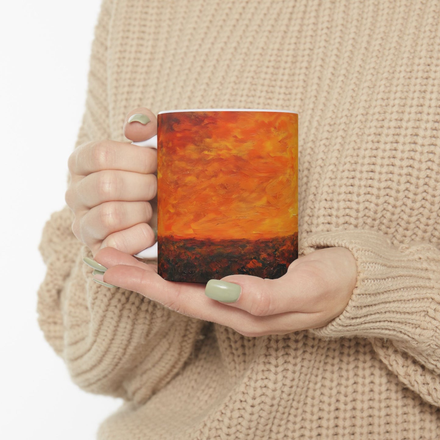 Woman in beige sweater holding coffee mug with abstract orange sunset landscape design