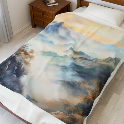 Cozy bed with a blanket featuring serene watercolor mountain landscape design, peaceful bedroom decor.