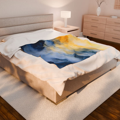 Bed with abstract blue and yellow Christian wall art style blanket in serene bedroom