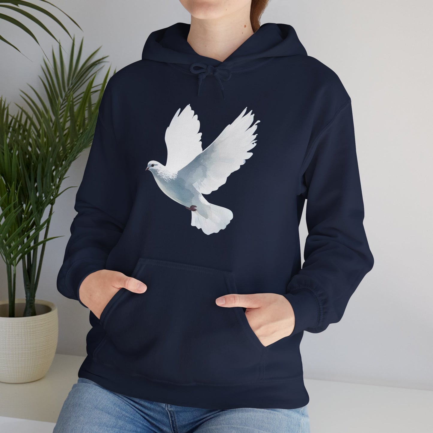 Navy blue hoodie with white dove graphic, Christian spiritual apparel, woman wearing it indoors