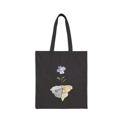 Black tote bag with watercolor flower and stone design, faith-inspired accessory