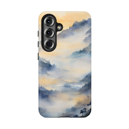Phone case with serene misty blue and gold mountain landscape, spiritual and mindful design