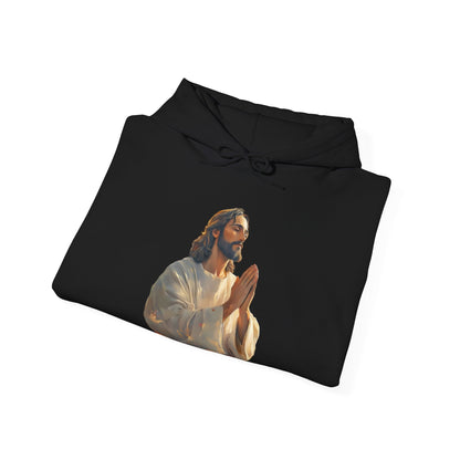 Black hoodie featuring a praying Jesus graphic, Christian faith-inspired apparel