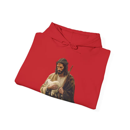 Red Christian hoodie featuring Jesus holding a lamb, faith-inspired apparel flat lay