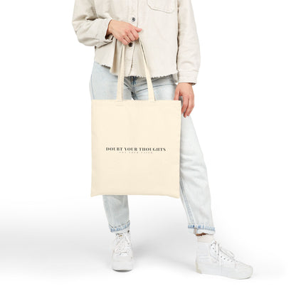 Beige tote bag with 'Doubt Your Thoughts Not Your Faith' quote, casual outfit, Christian accessory