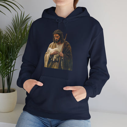 Woman wearing navy hoodie with Christian art of shepherd holding lamb, faith-inspired apparel
