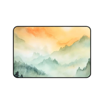Desk mat featuring a misty mountain landscape at sunset