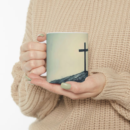 Woman holding coffee mug with Christian cross design on hill, faith-inspired home decor