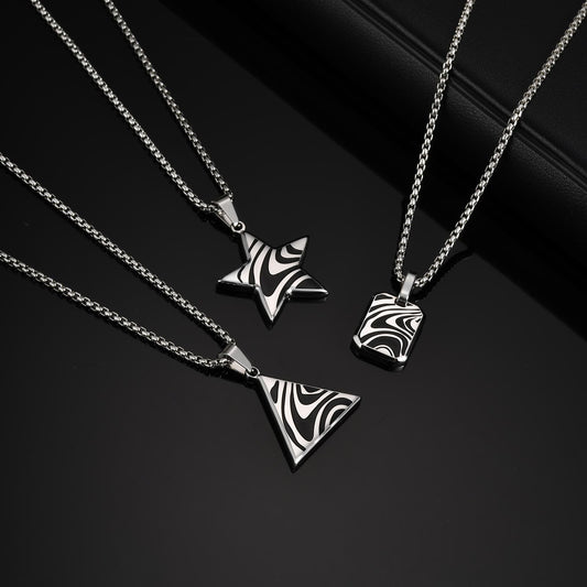 Silver-tone star, triangle and tag pendants with black wave-pattern detail