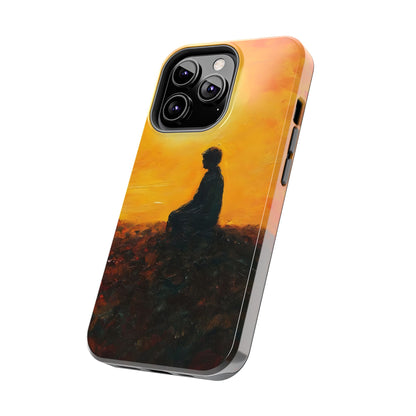 Phone case with silhouette of meditating person against orange sunset background