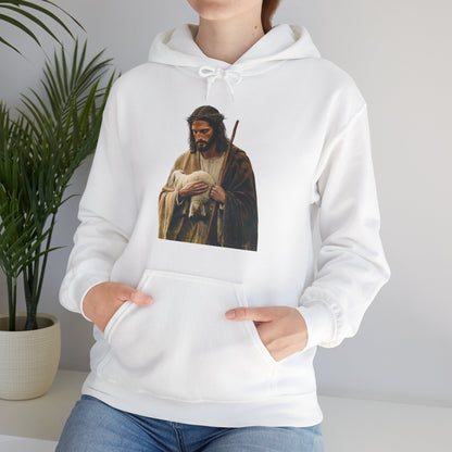 Woman wearing white Christian hoodie with Jesus holding lamb print, faith-inspired apparel