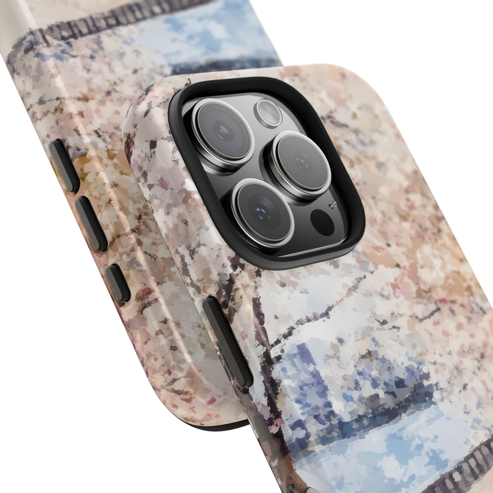 Close-up of a smartphone with a floral abstract pastel art case, showing camera lenses.