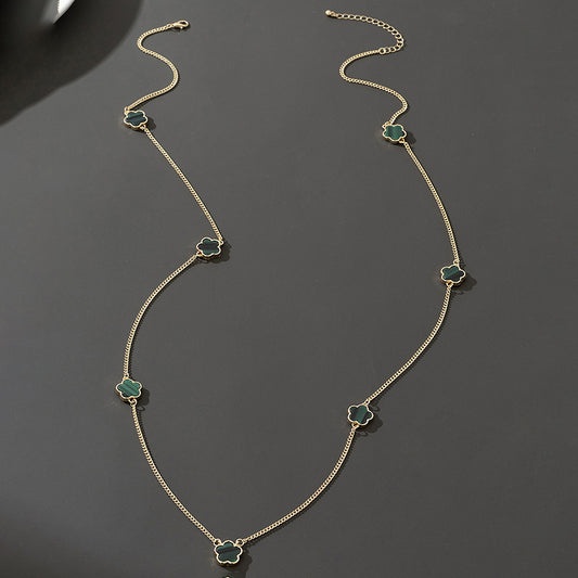 Long station necklace with dark small charms