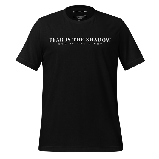 Black T-shirt with the words “Fear is the Shadow – God is the Light” in minimalist typography – PeaceBeyondThought Christian hope apparel.