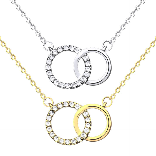 Gold-tone and silver-tone interlocking circle necklaces on a white background