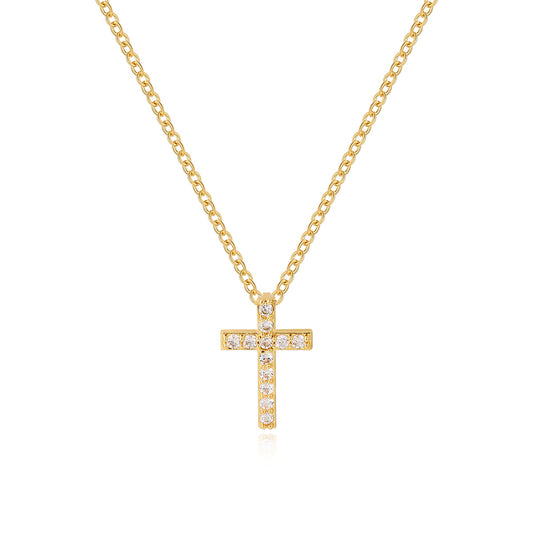 Gold-tone crystal cross pendant and fine chain isolated on white